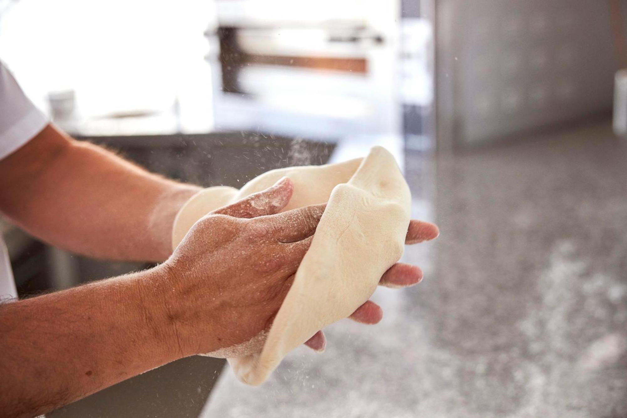 몬치크 리조트 앤 스파 몬시크 외부 사진 A baker kneading bread dough